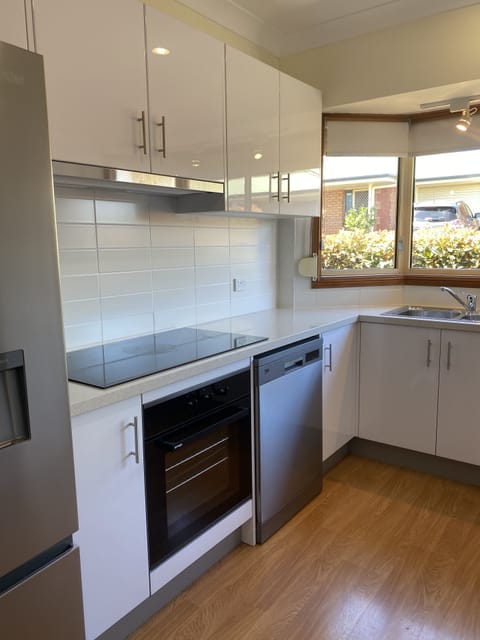 Three Bedroom Apartment (1 King, 1 Queen and 2 Double Beds) | Private kitchen | Full-size fridge, microwave, oven, stovetop