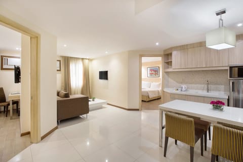 Royal Two Bedroom Suite | Living area | 21-inch TV with cable channels