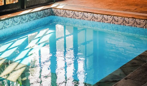 Indoor pool, open 9:00 AM to 10:00 PM, sun loungers