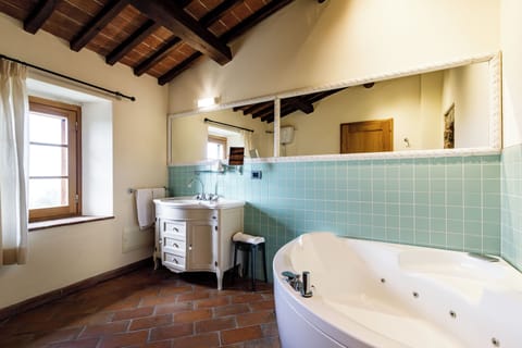 Prestige Suite | Bathroom | Designer toiletries, hair dryer, bathrobes, slippers