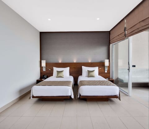 Deluxe Twin Room in Aria Wing - Lagoon View | Pillowtop beds, minibar, in-room safe, individually decorated