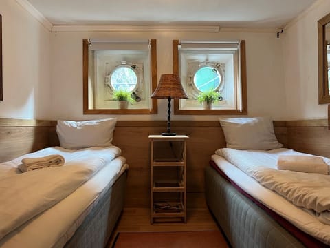 Basic Twin Room, 2 Twin Beds, Shared Bathroom (Cabin on boat ) | In-room safe, iron/ironing board, free WiFi, bed sheets