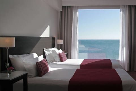 Classic Room, Ocean View | Minibar, in-room safe, desk, soundproofing