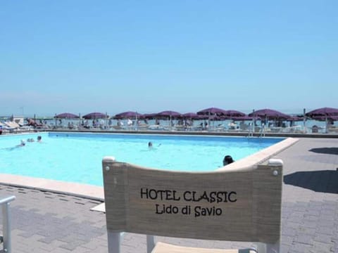 Outdoor pool, open 10:00 AM to 6:00 PM, pool umbrellas, sun loungers