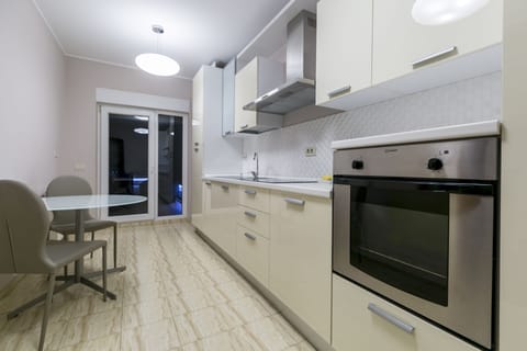 Penthouse Apartment | Private kitchen | Full-size fridge, microwave, coffee/tea maker, electric kettle