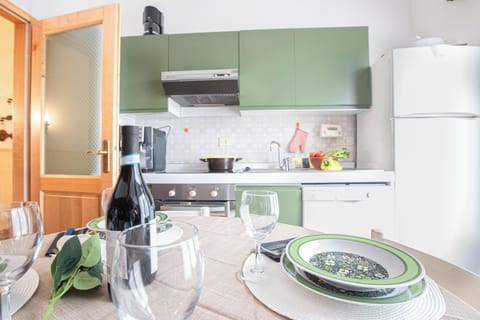 Family Apartment, 2 Bedrooms, Mountainside (Paradiso Al Mare shared pool) | Private kitchen | Fridge, oven, stovetop, dishwasher