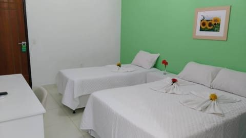 Family Triple Room, Multiple Beds | Minibar, in-room safe, free WiFi, bed sheets