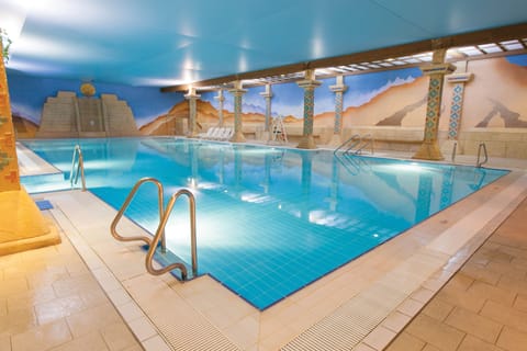 2 indoor pools, seasonal outdoor pool, open 7 AM to 9 PM, pool umbrellas