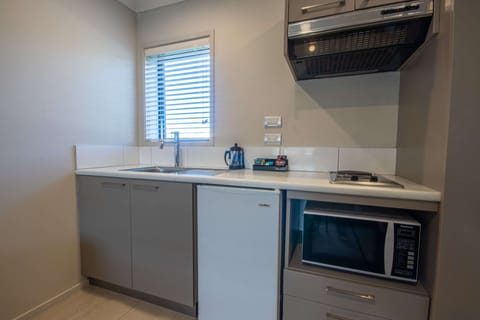 One Bedroom (Access) | Private kitchen | Fridge, microwave, coffee/tea maker, electric kettle