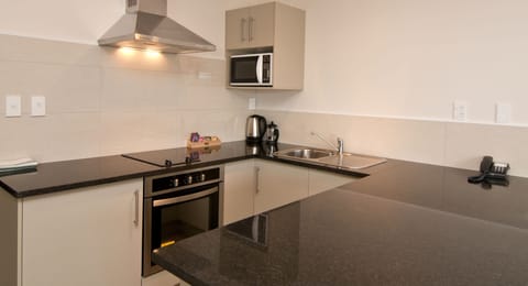 Lower Seaview Suite | Private kitchen | Fridge, microwave, stovetop, coffee/tea maker