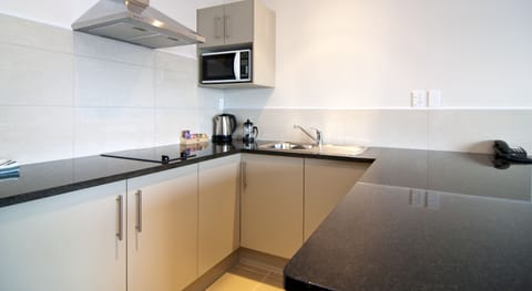 Suite, 1 Bedroom, Partial Sea View | Private kitchenette | Fridge, microwave, stovetop, coffee/tea maker