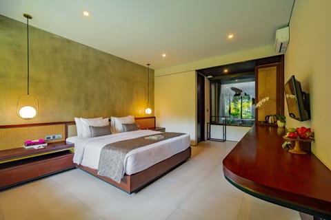 Deluxe Room, Pool Access, Pool View | In-room safe, desk, laptop workspace, soundproofing