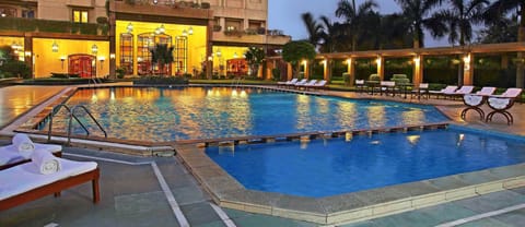 Outdoor pool, open 6:00 AM to 8:00 PM, sun loungers