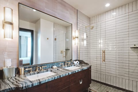 Silver Suite | Bathroom | Rainfall showerhead, designer toiletries, hair dryer, bathrobes