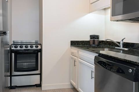 Suite, 2 Bedrooms, Non Smoking (1 King/2 Doubles) | Private kitchen | Fridge, microwave, stovetop, dishwasher