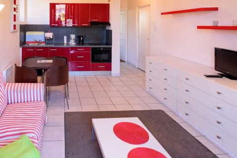 Apartment, 1 Bedroom | Living area | 80-cm flat-screen TV with digital channels, TV