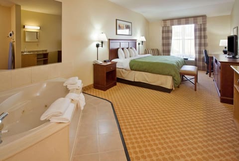 Suite, 1 King Bed, Non Smoking, Jetted Tub | Desk, iron/ironing board, free cribs/infant beds, rollaway beds