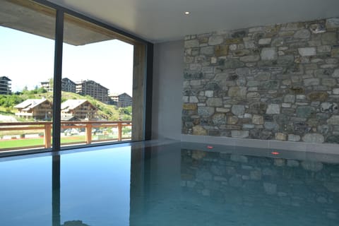 Indoor pool, outdoor pool, pool umbrellas, sun loungers