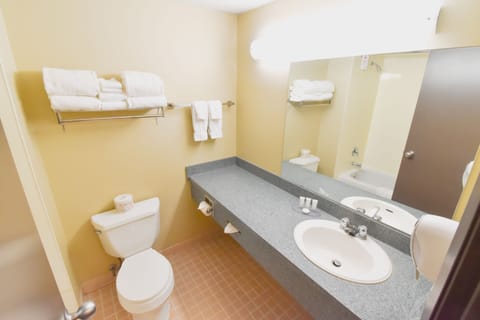 Deluxe Room, 2 Queen Beds | Bathroom | Combined shower/tub, hair dryer, towels