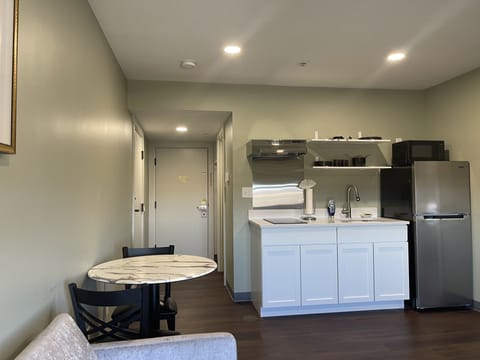 Premium Suite, 1 King Bed with Sofa bed | Private kitchen | Mini-fridge, cleaning supplies, paper towels