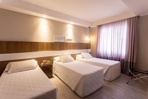 Standard Triple Room | Minibar, in-room safe, blackout drapes, free WiFi