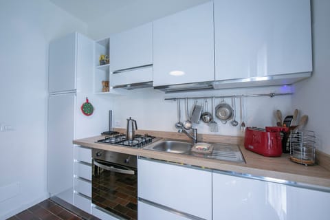 Family Townhome, 3 Bedrooms, 2 Bathrooms, Mountainside (Residenza La Parusciola) | Private kitchen | Fridge, oven, stovetop, dishwasher