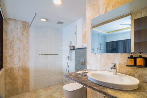 Premium Room | Bathroom | Rainfall showerhead, designer toiletries, hair dryer, slippers