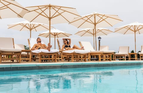 Seasonal outdoor pool, pool umbrellas, sun loungers