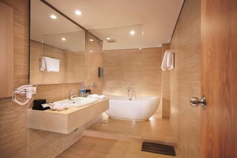 Harper Suite | Bathroom | Rainfall showerhead, free toiletries, hair dryer, slippers