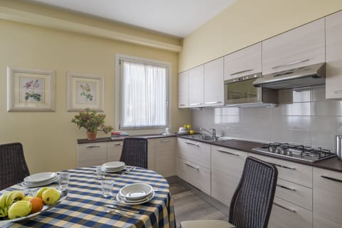 Apartment, 2 Bedrooms | Private kitchenette | Full-size fridge, microwave, stovetop, coffee/tea maker