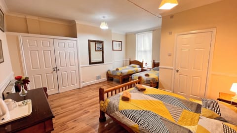 Family Room, Private Bathroom (Sleeps 4) | Individually decorated, iron/ironing board, free WiFi, bed sheets