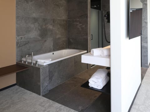 Junior Suite, 1 King Bed, Bathtub, River View | 1 bedroom, in-room safe, desk, iron/ironing board