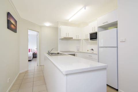 Two Bedroom Apartment | Private kitchen | Full-size fridge, microwave, stovetop, dishwasher