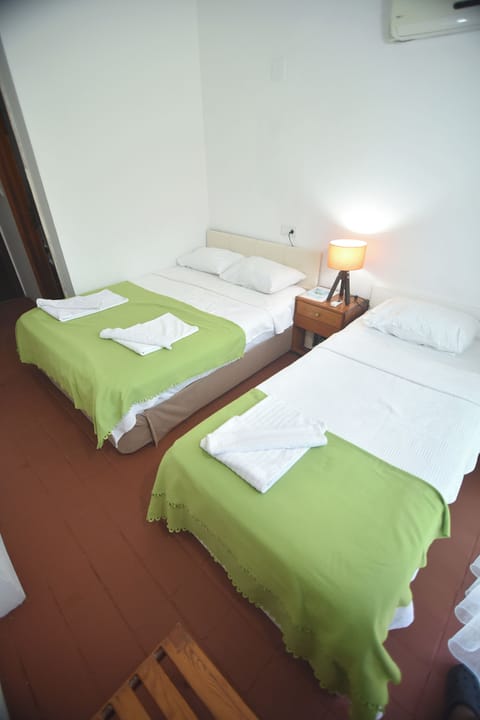 Family Triple Room, Multiple Beds | Free minibar items, free WiFi, bed sheets