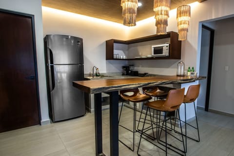 Luxury Apartment | Private kitchen | Full-size fridge, microwave, cookware/dishes/utensils