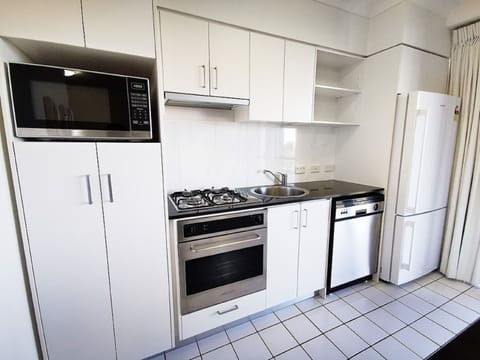 Standard One-Bedroom Apartment | Private kitchen | Fridge, microwave, oven, stovetop