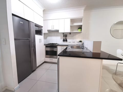 Standard Two-Bedroom Apartment | Private kitchen | Fridge, microwave, oven, stovetop