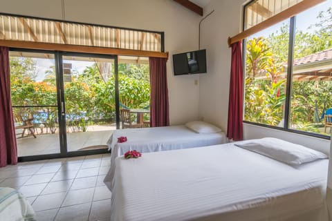 Deluxe Villa, Kitchen, Garden View | Down comforters, in-room safe, desk, free WiFi