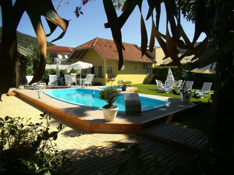 2 outdoor pools, open 9:00 AM to 9:30 PM, pool umbrellas, sun loungers