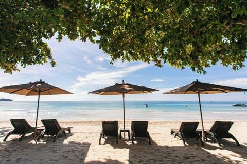 On the beach, white sand, beach towels, kayaking