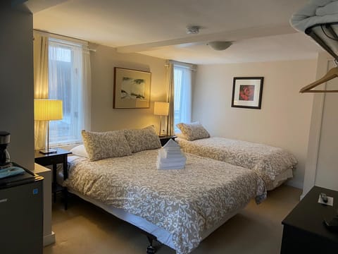 Comfort Room, 1 Bedroom, Private Bathroom (Lower Level) | Iron/ironing board, free WiFi, bed sheets