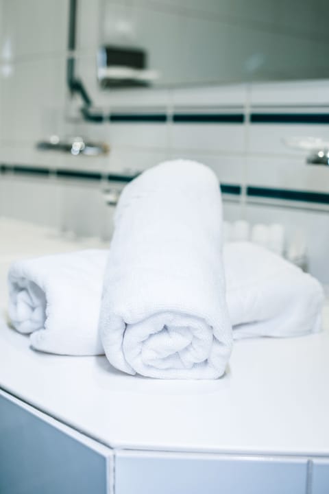 Hair dryer, bathrobes, slippers, towels