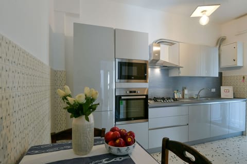 Apartment | Private kitchen | Full-size fridge, oven, dishwasher, cookware/dishes/utensils