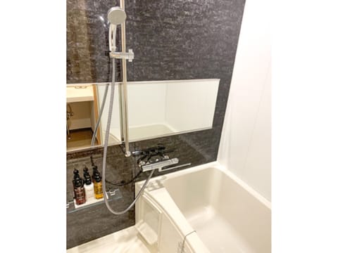 Fourth Room, Non Smoking | Bathroom | Combined shower/tub, free toiletries, hair dryer, slippers