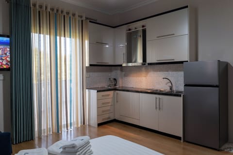 Quadruple Room with Kitchen | In-room safe, free WiFi, bed sheets