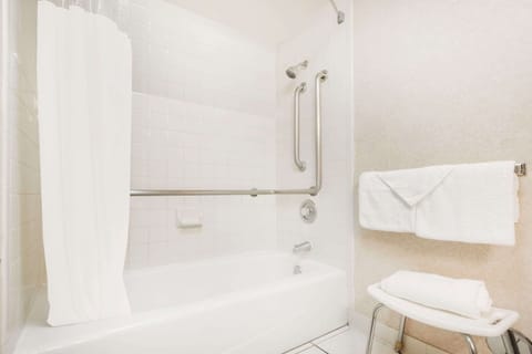 Bathtub, eco-friendly toiletries, hair dryer, towels