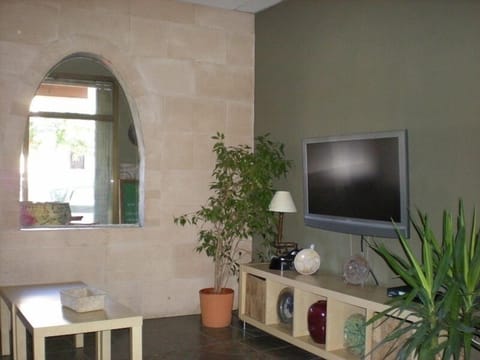 Triple Room | Living area | Flat-screen TV