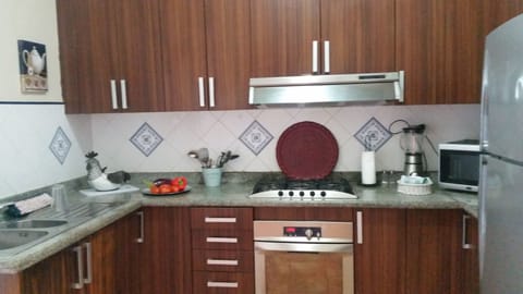 Apartment, 1 Bedroom | Private kitchen | Full-size fridge, microwave, stovetop, coffee/tea maker