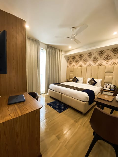 Sky Deluxe Room | Premium bedding, minibar, desk, laptop workspace