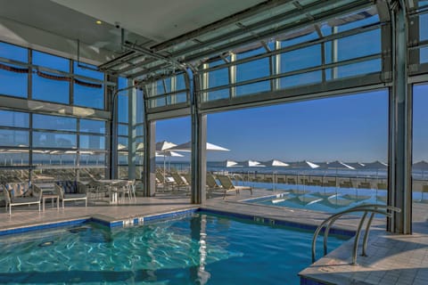 Indoor pool, outdoor pool, open 7:00 AM to 11:00 PM, pool umbrellas